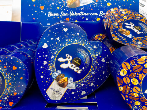 Alba, Italy - February 27, 2024: Baci Perugina chocolates in heart-shaped confections for Valentine's Day displayed for sale in Italian supermarket
