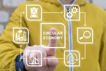 Man using virtual touch screen presses inscription: CIRCULAR ECONOMY. Concept of circular economy...