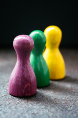 Three pawn-style playing pieces standing together