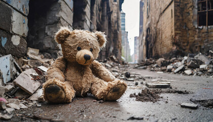Old teddy bear lies alone on a street in destroyed city ruins - obrazy, fototapety, plakaty