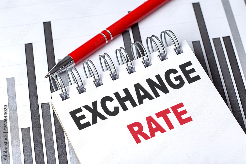 Poster exchange rate text written on notebook with pen on chart