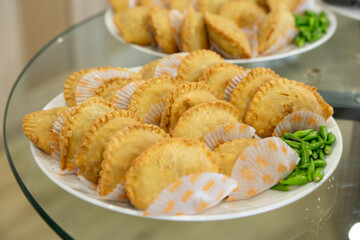 Jajanan pasar, various Indonesia traditional market snack, such as pastel, risol, donat, onde-onde and martabak mini.