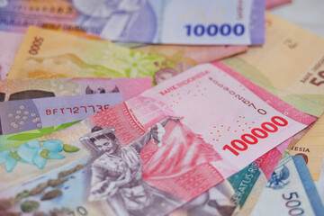 Close up of Rupiah banknotes. The rupiah is the official currency of Indonesia issued and controlled by Bank Indonesia