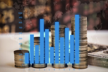 Money coins and graphs on old data background. Investment concept.