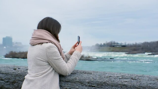 Woman Taking Pictures at Niagara Falls, Ontario