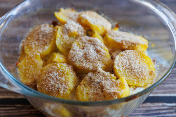 Finnish Food: Casserole made from potatoes and herring close up in baking dish. Horizontal view from above