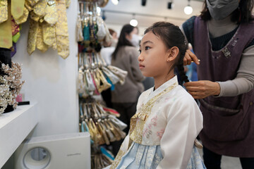 A Korean child girl wearing Hanbok and makeup in Seoul, Republic of Korea...