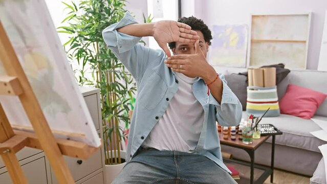 African american man framing with hands studio creative indoor casual