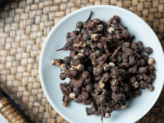 oriental raisin tree berries , traditional herbal medicine	