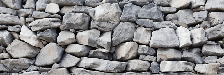 Light gray rock texture background. Rough slate mountain surface. Grey stone background with space for design. Rocky white bricks