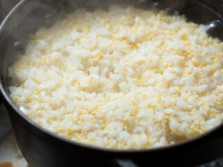 glutinous millet rice in a cauldron 