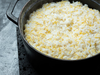 glutinous millet rice in a cauldron	
