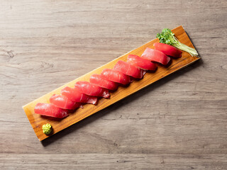 Tuna sushi on wooden plate	