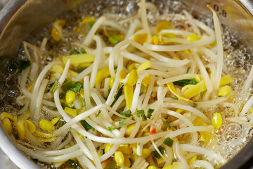 Bean sprouts and dry seasoning in a pot