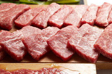 raw meat on a wooden board	