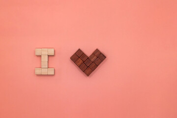 私は何かが好きですと伝える事をブロックで表現したピンクの背景