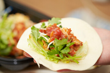A Mexican food where meat, beans, vegetables