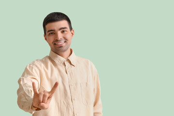 Young man showing 