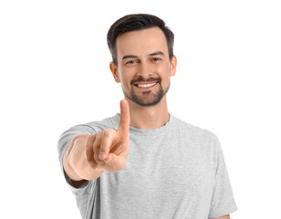 Handsome man using virtual screen on white background