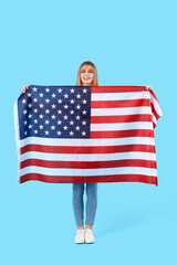 Teenage girl with USA flag on blue background