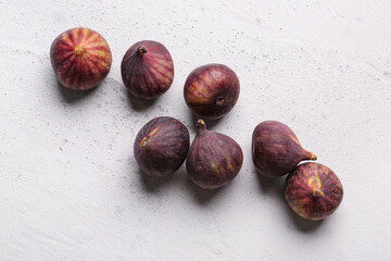 Fresh ripe figs on grey background
