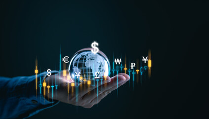 Businessman holding Crystal world with international currency include USD dollar Euro Yuan Yen Ruble Pound sterling for money transfer and forex exchange concept.