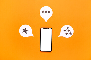 Speech bubbles with rating stars and mobile phone on orange background. Customer experience concept