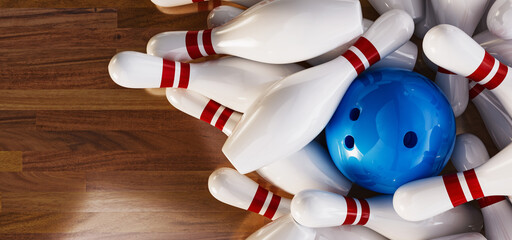 Bowling balls and bowling pins placed on a wooden background.