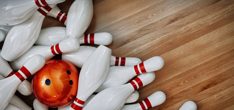 Bowling balls and bowling pins placed on a wooden background.