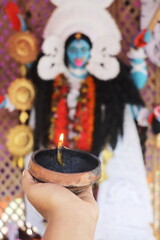 idol of hindu goddess maa kali, indian traditional festival kali puja, worship of goddess kali