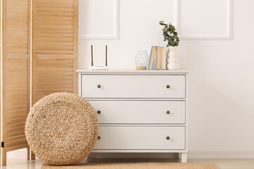 Interior of living room with wi-fi router on commode