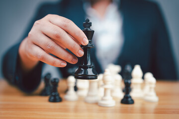 Plan leading strategy of successful business competition leader concept, Hand of player chess board...