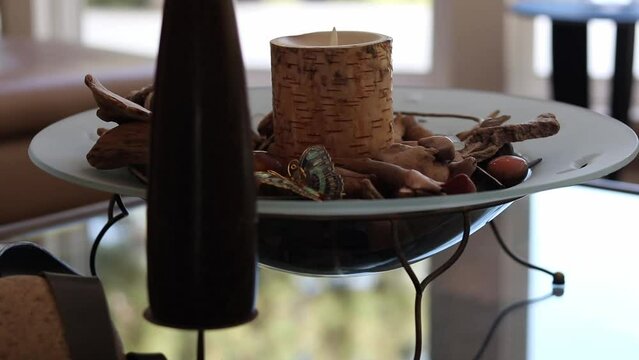 Close up shot of a birch candle in a bowl. Shot at 60FPS, slowed down to 24FPS. Shot on canon 80D with 50mm f1.8. STM.