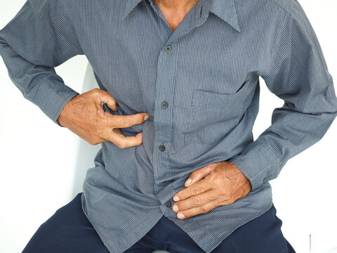 Man suffering from appendicitis inflammation on white background, Medical concept.