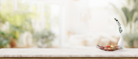 A white marble desk against the blurred background of a modern living room with houseplants.