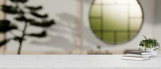 A white marble tabletop with a blurred background of a minimal Japanese Zen living room.