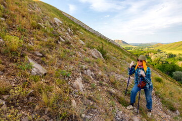 Fototapeta premium beautiful mature women travels through the mountains of the Southern Urals