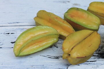 Several star fruit on the table

