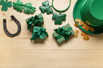 Gift boxes with leprechaun hat, horseshoe and plastic eyeglasses for St. Patrick's Day celebration...