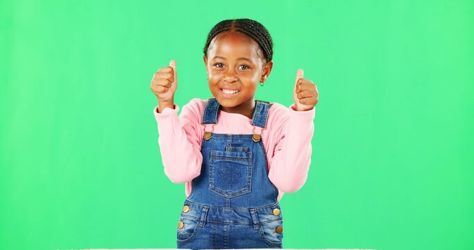 Child, thumbs up and portrait by green screen with smile for like, thanks or vote for agreement. Girl, African kid and happy with emoji, icon and sign language by chromakey with feedback for decision