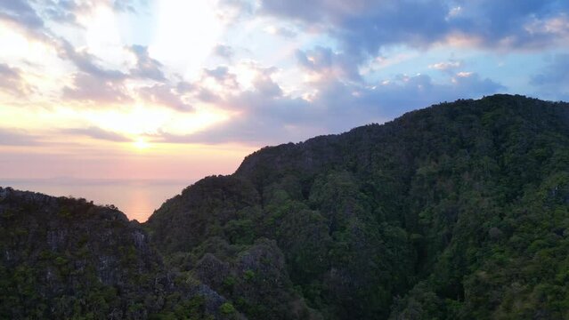 Majestic sunset over rugged mountain peaks. Lovely aerial top view flight panorama overview drone
4k footage