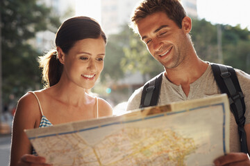 Happy couple, tourism and city with map for destination, location or tour guide on street or road....