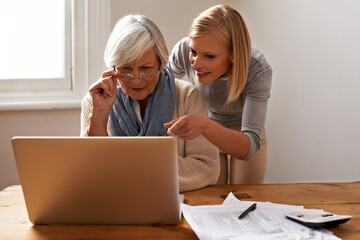Granddaughter, grandmother and help with laptop for online payment, finance and technology with...