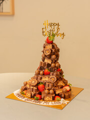 Birthday cake tower type with chocolates and fruits