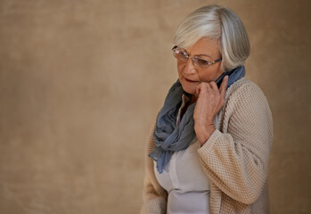 Senior woman, phone call and communication on tech, talking and app for conversation in home....