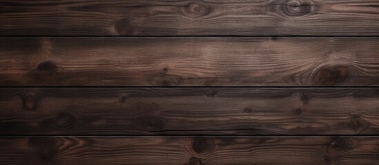 A closeup image of a wooden wall with a seamless dark brown stain applied to it, creating a textured background.