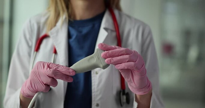 Doctor holds in hand ultrasound probe ultrasound machine