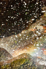 Rainbow forms at the base of Blackledge Falls in Connecticut.