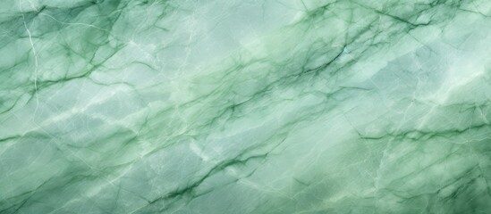 A close-up view of a light green marble texture background, showcasing intricate veins and patterns. The textured surface provides a decorative stone element suitable for interior design applications.