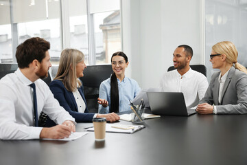 Lawyers working together at table in office